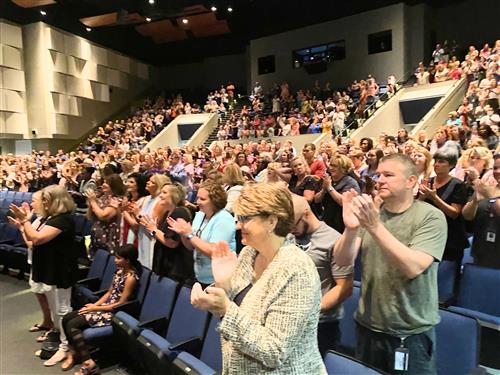 crowd shot in auditorium of teachers